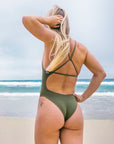 Fixed-back detailing of the Albi Olive swimsuit showcasing the cross-back design and mid-coverage bum fit.