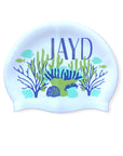 Coral Coast JAYD swim cap depicting reef illustration with blue and green corals, fish and shells.