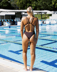 Emily wears JAYD Swimwear's athletic, chlorine resistant one piece called Finley. This piece offers double straps for ultimate tension distribution. She is wearing the colour Cacao.