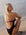 Paralympic swimmer Keira wears the contrasting Airlie one piece in the colour Acai with Fairy Floss straps and back detailing. This piece is designed for leisure and training.