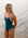 Athlete Ella wears the contrasting Airlie one piece in the colour Cove with contrasting sunshine straps. This piece is Ella's favourite for pool training due to being chlorine resistant and offering a full coverage.