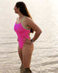 JAYD Swimwear athlete Jenaya Massie wears the contrasting adjustable fixed back one piece by JAYD Swimwear in the colour Pink Sorbet. This is her go to for long training sessions as it is super comfortable.