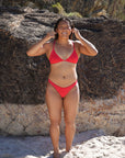 Athlete Sara wears the Kiama top by JAYD Swimwear in the colour Ruby. This top is fixed back and built for both training and beach days.