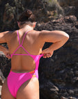 JAYD Swimwear athlete Madi wears the fixed back Lennox one piece in the colour Pink Sorbet with contrasting orchid straps. This piece is designed for performance and will stick with you lap after lap.