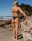 Athlete Emily wears the fixed back swim top by JAYD Swimwear called Kiama. She is wearing it in the Cacao colour, made from a chlorine resistant fabric.