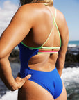 Cobalt full-coverage chlorine-resistant swimsuit by JAYD Swimwear with contrasting splice straps, modelled by ambassador and surf ironwoman Olivia Corrin.