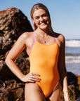 Athlete Emily wears JAYD Swimwear's athletic one piece Lennox. She is wearing the sunshine colour, which is double lined to ensure no see-through scandals.