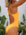 Close side view of model wearing athletic swimsuit Finley One Piece in Sunshine by JAYD Swimwear