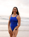 Athlete Jenaya wears the JAYD Swimwear fixed back one piece called Soraya in the colour Cobalt. She wears it at the beach as it is designed to flatter and is made for movement.