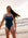 Ski Paddler Jenaya wears her fixed back one piece by JAYD Swimwear called the Soraya in the colour Cove. She is seen at the beach, as this piece is both flattering and functional.