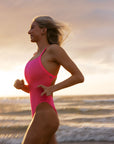 Athlete Keira puts the Soraya fixed back one piece designed by JAYD Swimwear to the test as she runs along the beach. This one piece is supportive and made to move.