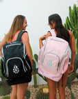 Two models wearing the black and pink shades of the JAYD Backpack.