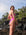 JAYD Swimwear, athletic one piece, tallow in pink sorbet, view of the side of the suit