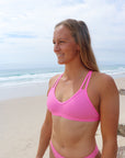Front view of JAYD Swimwear Tazzie athletic bikini top in Fairy Floss pink