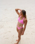 Front view of JAYD Swimwear Tazzie athletic bikini top in Fairy Floss pink
