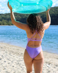 Rear view of JAYD Swimwear's full-coverage athletic one-piece Airlie in the shade Lilac Haze.