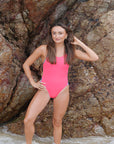 Fiesta Ibiza athletic one piece by JAYD Swimwear with Atlantic contrast straps, worn by triathlete and ambassador Lauren Kerwick. High-support women’s one piece for squad training, laps, surf sessions and endurance performance.