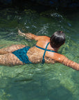 Back view of athletic swimsuit Levanto One Piece in Cove Green by JAYD Swimwear