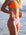 Side view of model on a beach wearing JAYD Swimwear athletic bikini bottoms Demi in Lilac Haze.