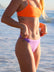 Side view of model on a beach wearing JAYD Swimwear athletic bikini bottoms Demi in Lilac Haze.