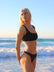 Front view of model wearing JAYD Swimwear cheeky bikini bottom Demi in Black.