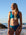 Front view of model on beach wearing JAYD Swimwear cheeky bikini bottom Demi in Nordic Blue.