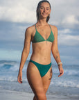 Front view of JAYD Swimwear Cali athletic mid-coverage bikini bottoms in Cove Green by JAYD Swimwear.