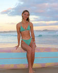 Front view of JAYD Swimwear Cali athletic bikini bottoms in Matcha Green by JAYD Swimwear