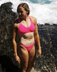 Build for adventure, ironwoman Olivia Corrin wears the JAYD Swimwear ZALI bikini swim bottom in Pink Sorbet, showcasing durable stitching, chlorine resistant fabric and a secure, sporty fit.