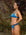 Side view of model wearing athletic, cheeky coverage JAYD Swimwear Minnie bikini bottoms in Nordic blue.