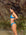 Side view of model wearing JAYD Swimwear athletic Triangle training bikini top in Nordic Blue.