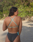Chlorine resistant performance swimsuit, the IBIZA One Piece in Carbon Grey with Sea Mist blue contrasting back straps.