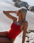 Female athlete in JAYD Swimwear Albi One Piece Ruby Red, designed for ocean swims, pool training, and surf life saving