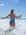 JAYD Swimwear, athletic one piece, Finley, in Cancun colour, jumping in the waves.