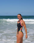 Engineered for athletes, worn by champions. Molly makes waves in the Ibiza One Piece swimsuit in Black with bold contrasting Pink Sorbet hip cut-outs.