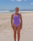 The Levanto One Piece swimsuit by JAYD Swimwear, in Lilac Haze. The elevated neckine provides maximum coverage for athletes.