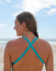 The Levanto One Piece swimsuit by JAYD Swimwear, in Atlantic. Open back straps over the shoulders.