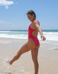 Side view of Apsley One Piece Athletic Swimsuit in Ruby by JAYD Swimwear
