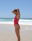 Side view of Apsley One Piece Athletic Swimsuit in Ruby by JAYD Swimwear