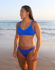 Front view of JAYD Swimwear Tazzie athletic bikini top in Cobalt Blue