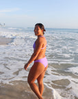 Side view of seamless JAYD Swimwear Cali athletic bikini bottoms in Lilac Haze