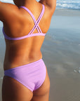 Close view of seamless JAYD Swimwear Cali athletic bikini bottoms in Lilac Haze