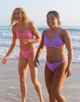 Front view of seamless, athletic, cheeky coverage JAYD Swimwear Minnie bikini bottoms in Fairy Floss pink.