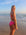 Side view of seamless, athletic, full coverage JAYD Swimwear Connie bikini bottoms in Pink Sorbet.