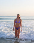 Front view of athletic cross-back JAYD Swimwear Kiama bikini top in Lilac Haze.