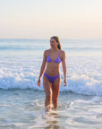 Front view of athletic cross-back JAYD Swimwear Kiama bikini top in Lilac Haze.