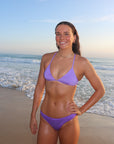 Front view of seamless, athletic, cheeky coverage JAYD Swimwear Minnie bikini bottoms in Lilac Haze.