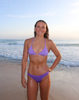 Front view of athletic cross-back JAYD Swimwear Kiama bikini top in Lilac Haze.