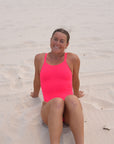 JAYD Swimwear, athletic one piece, Finley in the Fiesta colour. Frontal seated image.