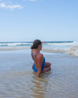 Back view of the double-strapped Finley One Piece Athletic Swimsuit in Nordic Blue, by JAYD Swimwear.